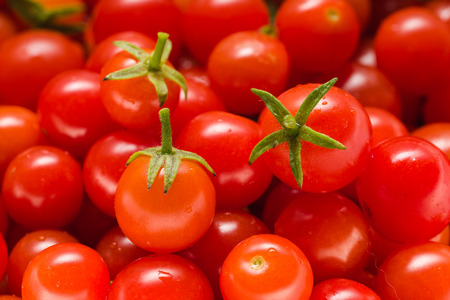 Lots of Small Ripe Red Cherry Tomatoes. Close Up. Macro. Top View. Background.の写真素材