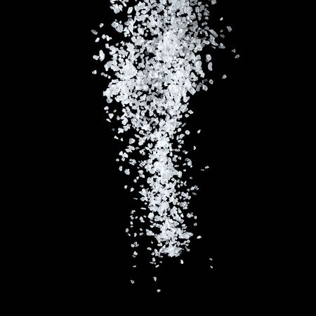 Large White Sea Salt Falling On A Black Background.の写真素材