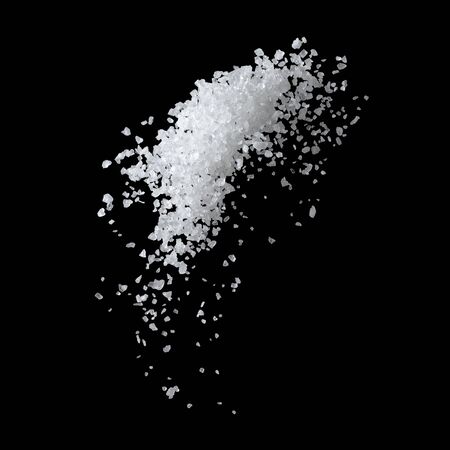 Large White Sea Salt Falling On A Black Background.の写真素材