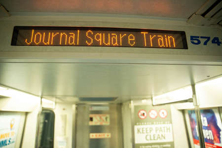 New York, NY - May 16 2020: The Path Train going from New Jersey to NYC sign saying via hoboken...