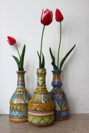 three tulips in three vasesの写真素材