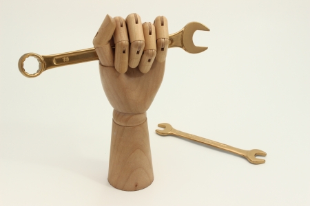 Gold wrench tool and rising cost of laborの写真素材