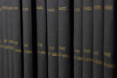 Blue books in a shelfの写真素材