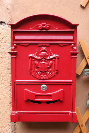 Red reproduction of wall mailbox of italian "Regie Poste" (Royal mail)の写真素材