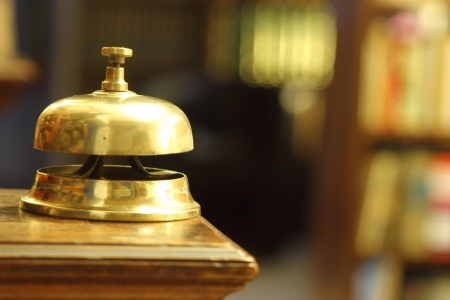 hotel brass bell in warm ambientの写真素材