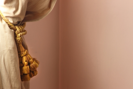 Curtain and tassel in a pink bedroomの写真素材