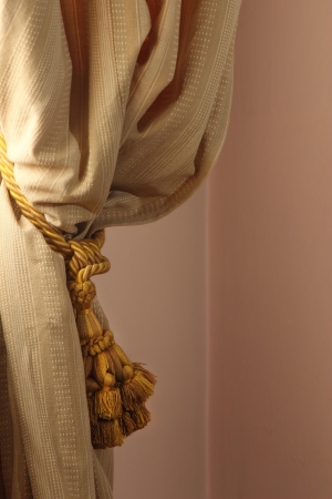 Curtain and tassel in a pink bedroomの写真素材