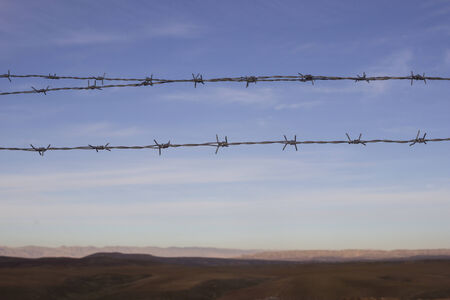 three Barbed wire and Iraq landscape  backgroundの写真素材