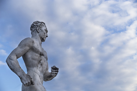 Statue of a runner in Stadio dei Marmi, Rome, Italyの写真素材
