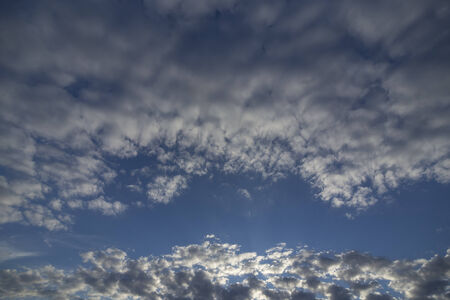 Blue sky among cloudsの写真素材