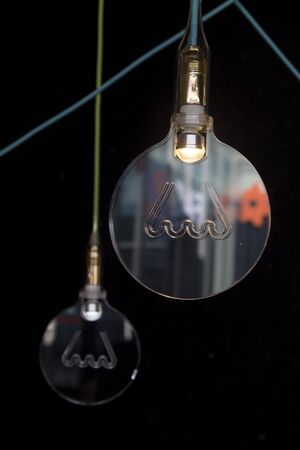 Symbol of tungsten lamp in plexiglassの写真素材