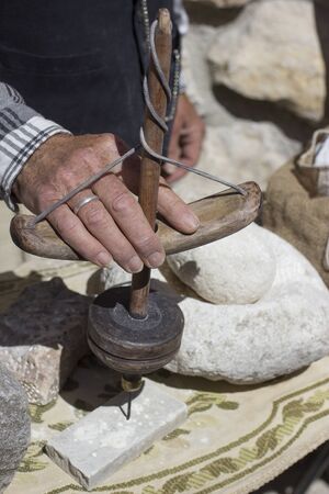 Ancient manual drill for stoneの写真素材