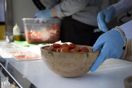 preparing sandwich with mozzarella and tomatoの写真素材