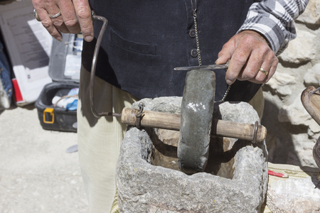 Knife grinder with whetstoneの写真素材