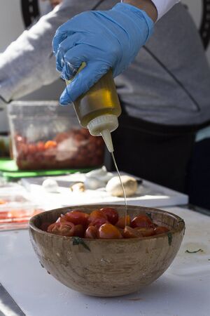 preparing sandwich with mozzarella and tomatoの写真素材