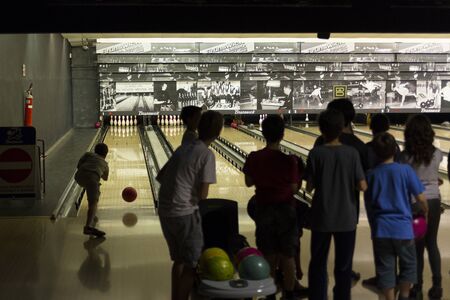 Rome, Italy, 05/12/2015 - Children's bowling match in Brunswick bowling center. Special children lanes were used for this match among children of secondary school, 11 years oldのeditorial素材