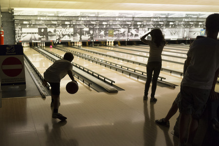 Rome, Italy, 05/12/2015 - Children's bowling match in Brunswick bowling center. Special children lanes were used for this match among children of secondary school, 11 years oldのeditorial素材