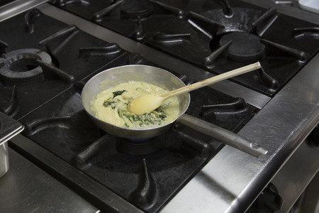 Food preparation in a restaurant kitchenの写真素材