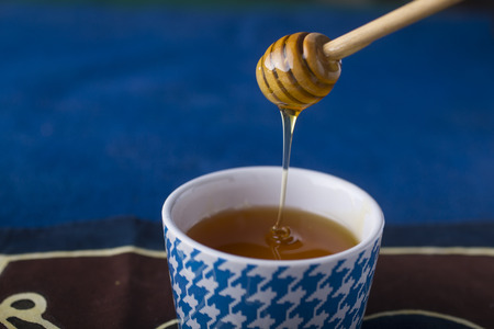 Morning breakfast with milk, corn flakes and honeyの写真素材