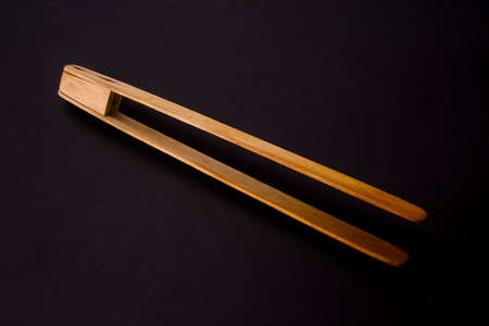 wooden kitchenware isolated on blackの写真素材