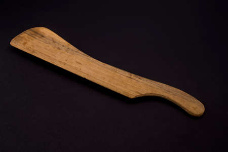 wooden kitchenware isolated on blackの写真素材