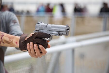Woman pointing a 9mm pistol