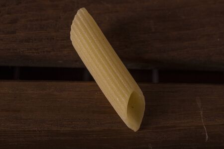 Penne, pasta from southern Italy tradition - macro detailの写真素材