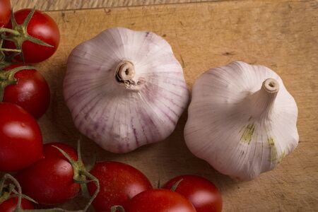 Garlic and tomatoes, basic ingredients for a tasty sauceの写真素材