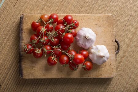 Garlic and tomatoes, basic ingredients for a tasty sauceの写真素材