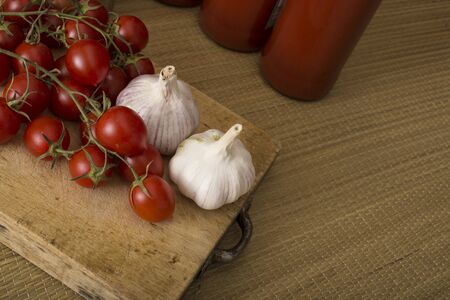 Garlic and tomatoes, basic ingredients for a tasty sauceの写真素材