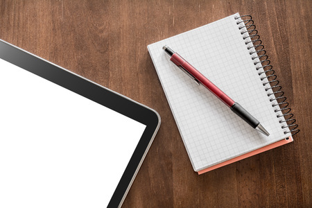 Notepad With Pencil And Tablet On A Living-Room Tableの写真素材