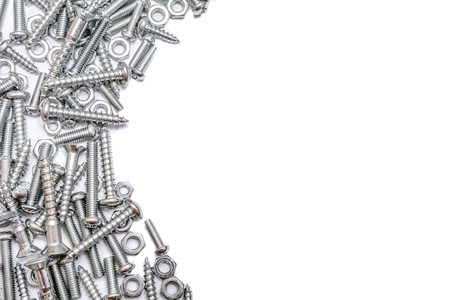 A Semicircle Collection Of Iron Screws, Woodscrews and Bolts At The Left Border Of A Whiteboxの写真素材