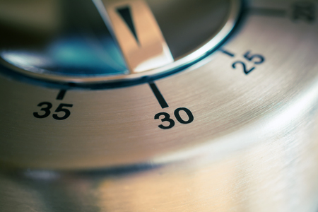 30 Minutes - A Macro Of An Analog Chrome Kitchen Timerの写真素材