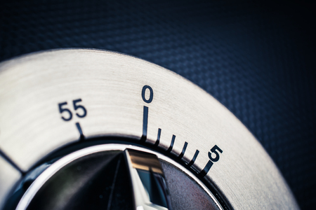 0 Minutes - 1 Hour - A Close-Up Of An Analog Chrome Kitchen Timer With Dark Backgroundの写真素材
