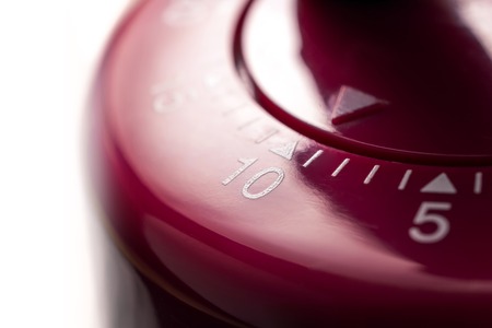 10 Minutes - A Macro Of A Flat Red Kitchen Egg Timer In Bright Atmosphereの写真素材