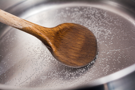 Wooden Cooking Spoon In A Stainless Pot With Boiling Waterの写真素材