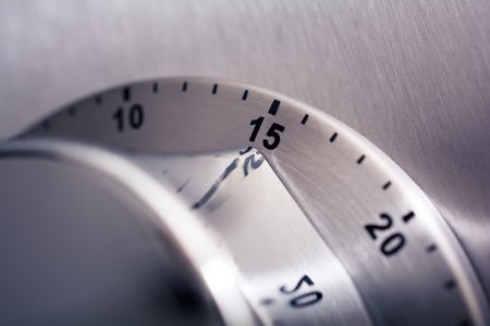 15 Minutes - Analog Chrome Kitchen Timer Placed On A Refrigeratoの写真素材