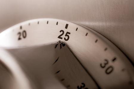 25 Minutes - Analog Chrome Kitchen Timer Placed On A Refrigeratoの写真素材