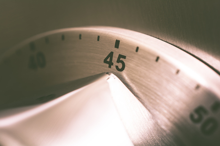 45 Minutes - Analog Chrome Kitchen Timer Placed On A Refrigeratoの写真素材