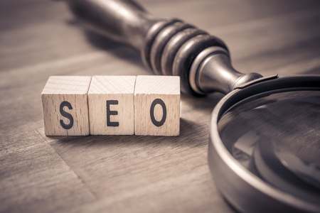 Vintage Loupe Lying Next to SEO Blocks In Monochrome Colors - Seの写真素材