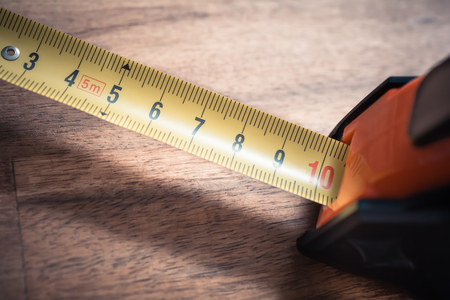 Macro Of A Solid Measuring Tape With Pulled Out Scale Standing O