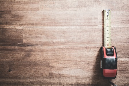 Solid Measuring Tape With Pulled Out Scale Lying At Right Side Oの写真素材