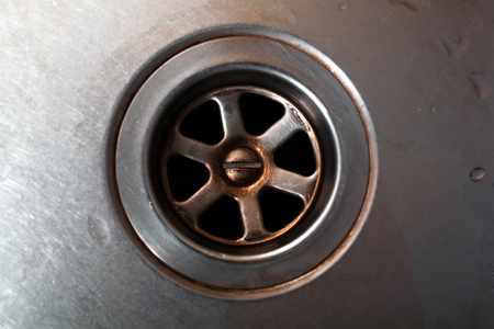 Dark Dirty Drain Of A Kitchen Sink With Waterdrops, Top Down Viewの写真素材