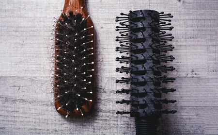 2 Brushes With Lost Hairs Lying Parellel To Each Other - Alopecia Hair Loss Conceptの写真素材