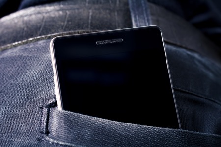 Black Smartphone With Copy Space In Dark Trouser Back Pocketの写真素材