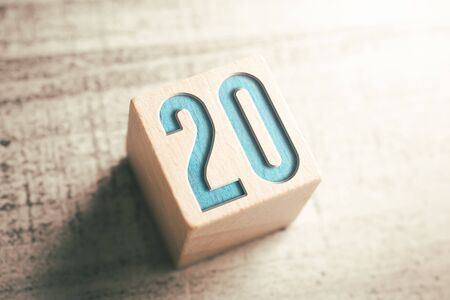 The Number 20 On A Wooden Block On A Tableの写真素材