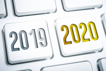 The Year 2019 And 2020 On Two White Keyboard Buttonsの写真素材