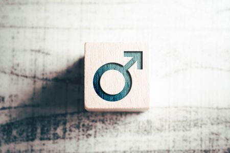 Gender Icon For Male On Wooden Block On A Tableの写真素材