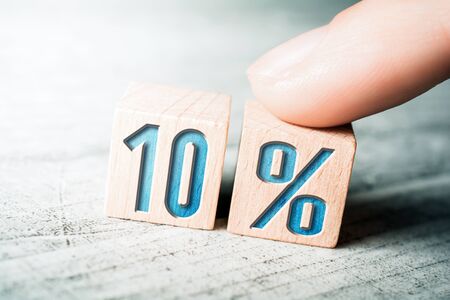 10 Percent Sale Discount Formed By Wooden Blocks And Arranged By Female Finger On A Tableの写真素材