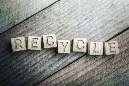 Recycling Written On Wooden Blocks On A Boardの写真素材